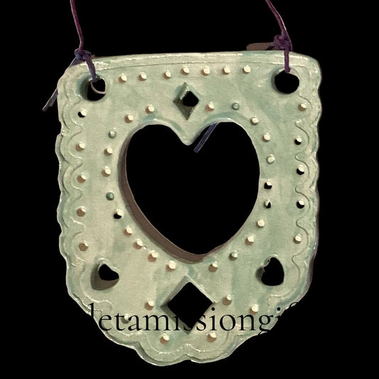 Teal ceramic ornament in papel picado style by Lorena Williams, decorative home and garden ornament with intricate cutout design.