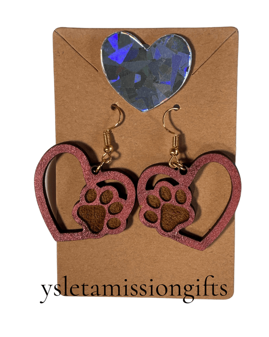Red laser-cut wood dangle earrings with paw print and heart design, crafted by Norma Cordova De Schaefer.