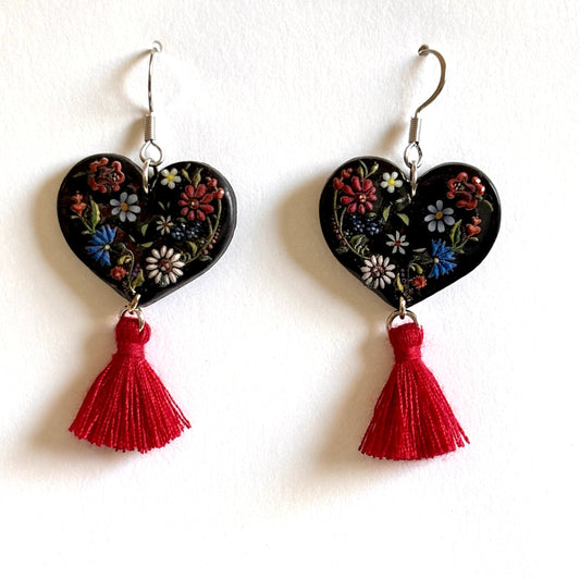 Polymer clay black and red floral heart dangle earrings by Melissa Cortinas, featuring intricate floral designs and dangling style.