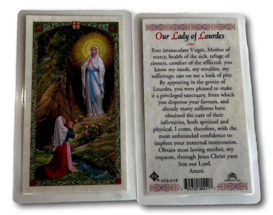 Catholic prayer card featuring Our Lady of Lourdes, from Ysleta Mission Gift Shop, with religious imagery and prayer text.