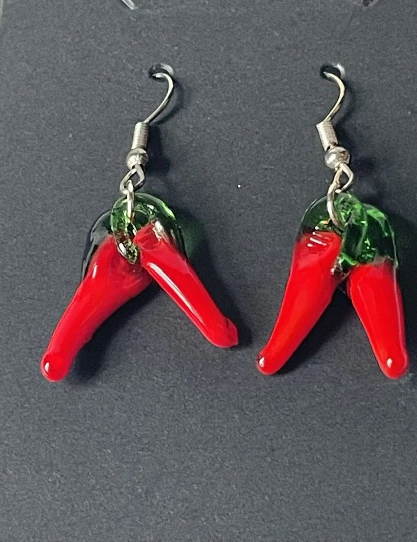 Pulled glass 1.5-inch dangle chili earrings by Sylvia Leroux featuring vibrant red glass chili design with silver hooks.