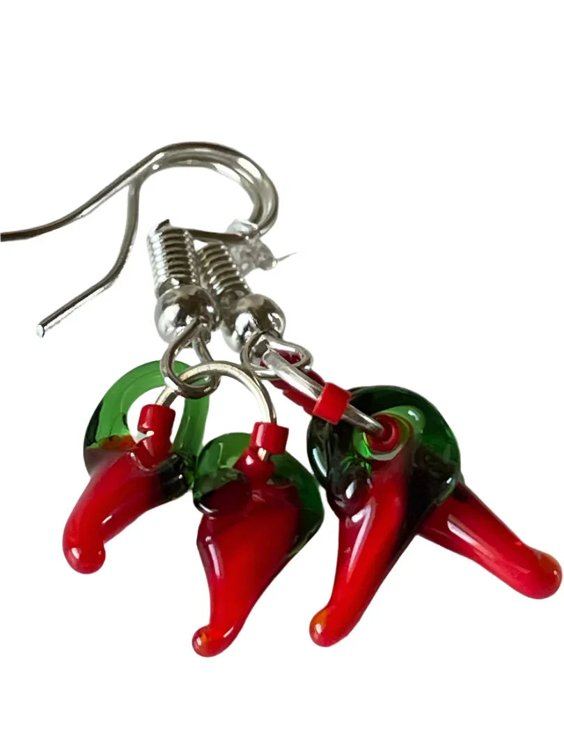 Red and green chili seed bead dangle earrings by Sylvia Leroux featuring vibrant chili pepper designs.