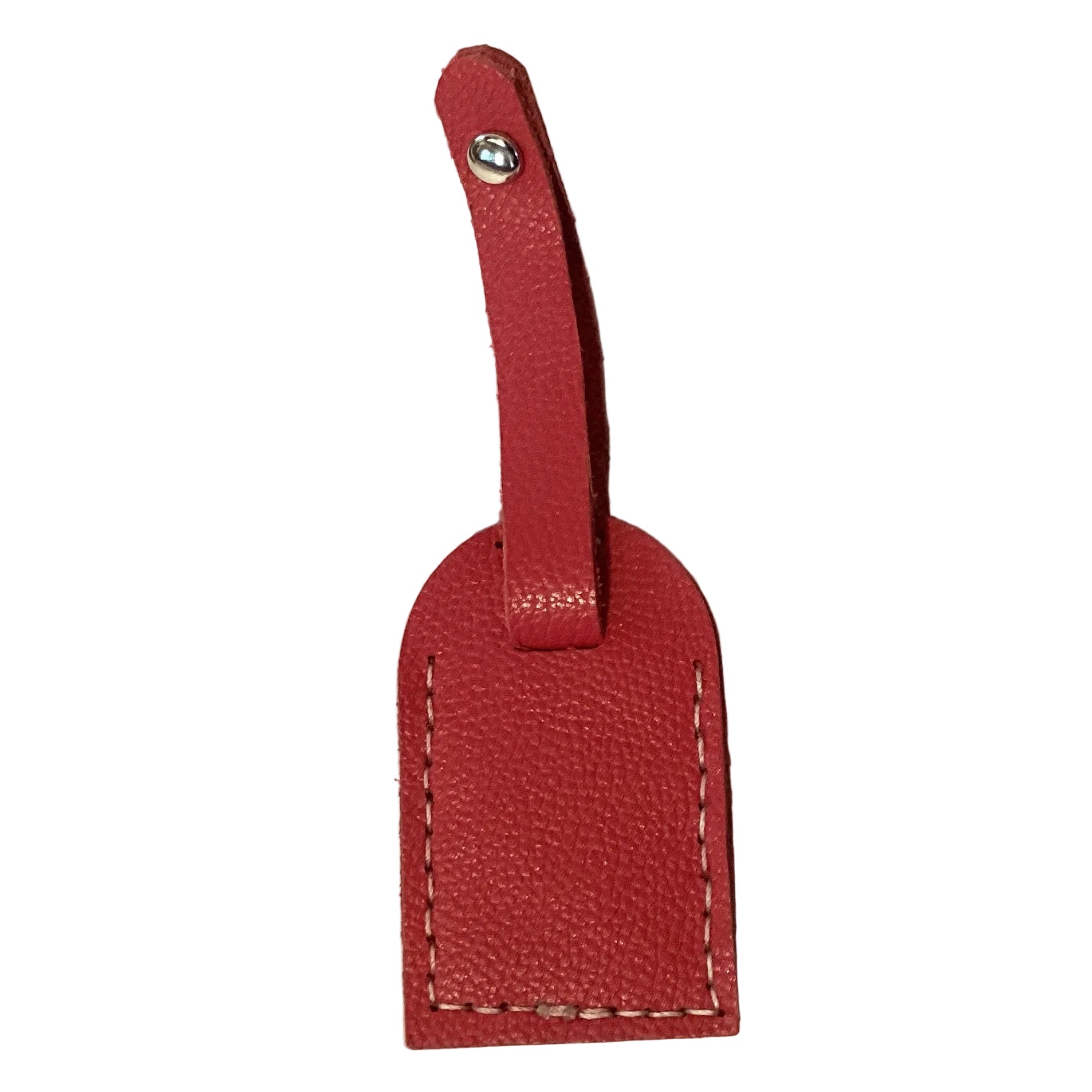 Red leather luggage tag by Consuelo Barraza, handmade travel accessory with secure strap for luggage identification.
