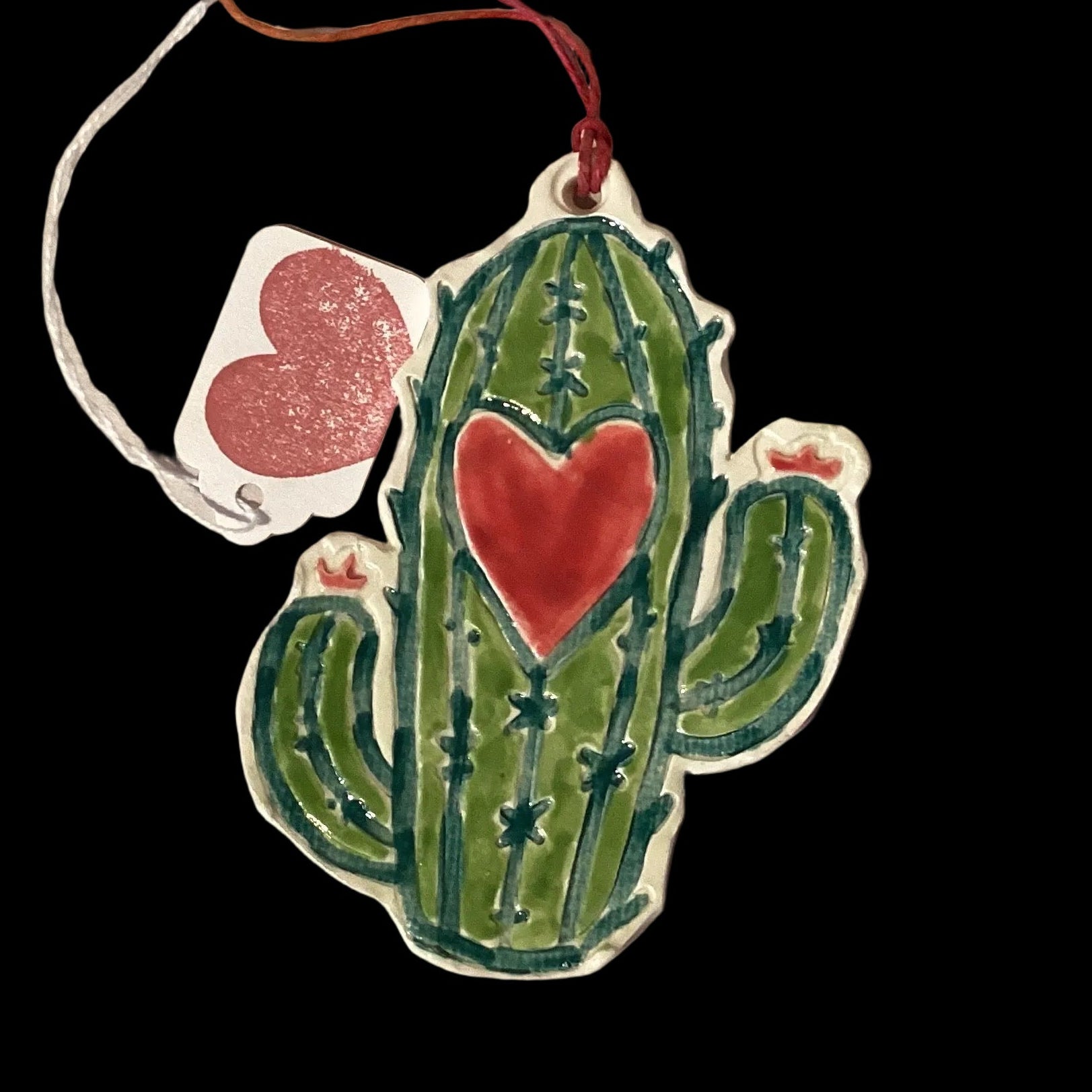 Red ceramic cactus ornament by Lorena Williams, decorative home and garden ornament with a cheerful Valentine’s Day theme.