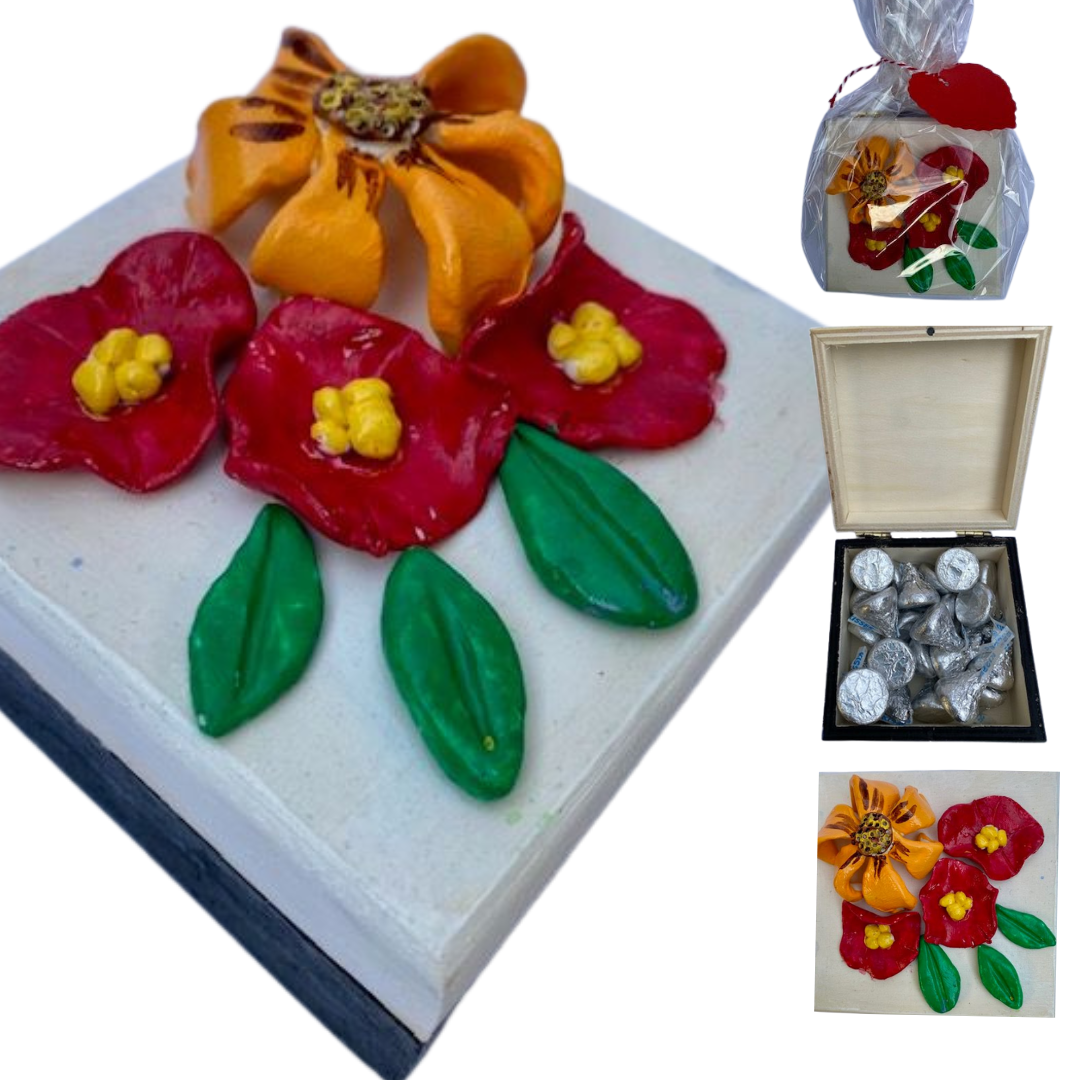 Floral gift box with a delicate 3-leaves design, filled with chocolate kisses