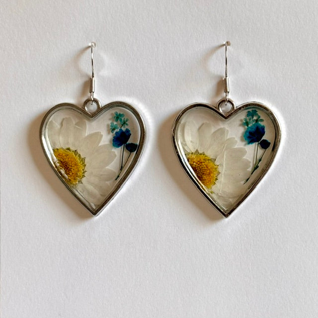 Resin floral heart dangle earrings with silver hooks, handcrafted jewelry from Ysleta Mission Gift Shop.