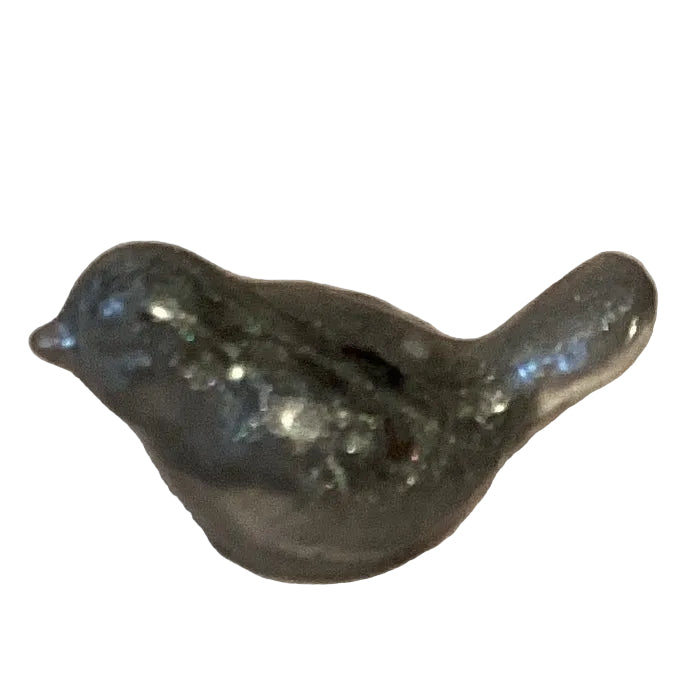 Silver glitter perched bird figurine, a mini resin craft sculpture, perfect for home decor and art projects.