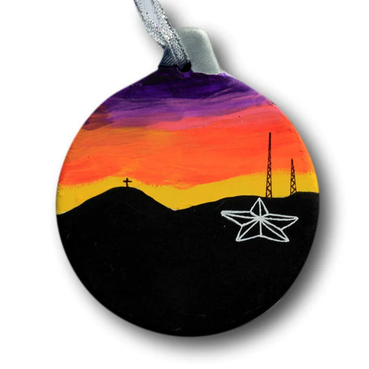 Purple ceramic Star and Cross sunset ornament by Miguel Martinez, ideal for seasonal Christmas faith decor display.