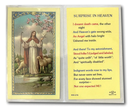 Laminated Catholic prayer card titled "Surprise in Heaven" featuring spiritual reflection and comfort, from Ysleta Mission Gift Shop.