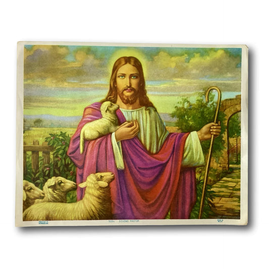 Framed Catholic art print titled "The Divine Shepherd – El Buen Pastor" from Ysleta Mission Gift Shop, depicting a pastoral Jesus figure.