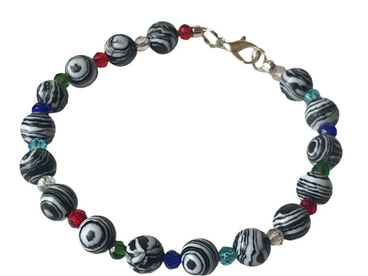 Vibrant Energy Bracelet by Sylvia Leroux featuring 8 Malachite black and white stones with multicolor gem spacers.