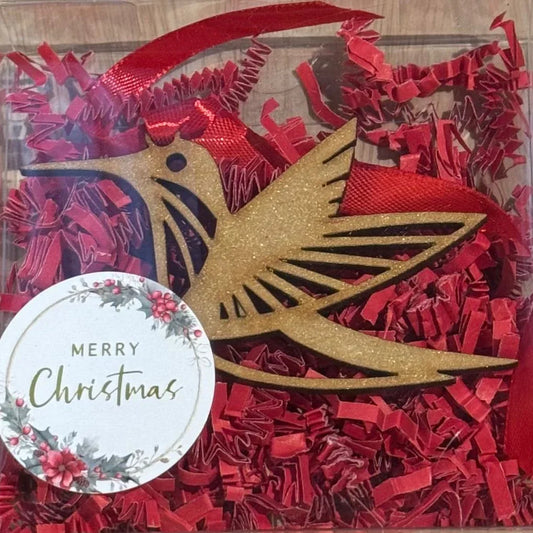 Laser-cut wood ornament featuring a hummingbird design, part of the holiday gift set by Norma Cordova De Schaefer.
