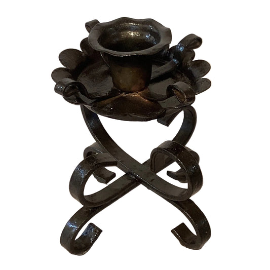 Rustic wrought iron candle holder with a handcrafted design, ideal for home decor and elegant candle displays.