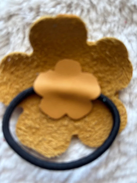 Yellow leather flower ponytail holder with matching bookmark, cheerful handmade accessory by Consuelo Barraza.